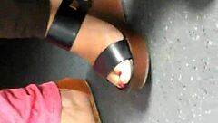 Mature Woman Hides Her Feet in Wedges and Sandals During Candid Moment