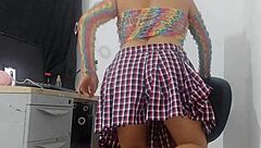 Sweet girl in miniskirt and fishnets rides huge horse dildo passionately