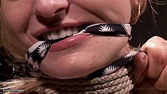 Blonde slave bound in suspension and fucked by monster cock