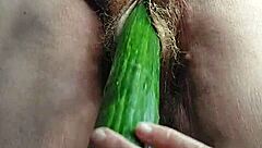 oma casually fucks her hairy pussy with a cucumber