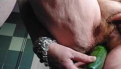 oma casually fucks her hairy pussy with a cucumber