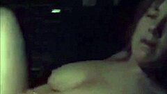 Busty milf fingering herself in car outdoors