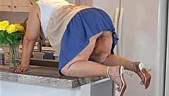 Is the real estate agent in mini dress no panties?