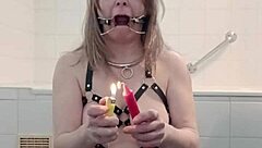 On March 19, 2025, the female slave endures bdsm humiliation with harness and candle