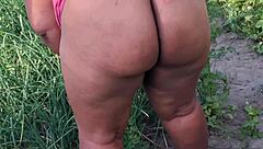 I'm tending to the church garden as a devoted believer, keeping everything neat and orderly in this peaceful setting.