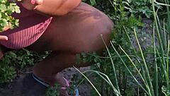 I'm tending to the church garden as a devoted believer, keeping everything neat and orderly in this peaceful setting.