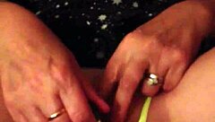 This milf slips into yellow panties and gets her pussy fingered deeply in a steamy homemade session. She moans as fingers explore every inch.