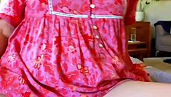 Mature woman proudly displays her huge plump shaved pussy lips spreading wide