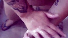 Man cums on her tits during armpit fetish play in bathroom shower