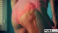 Britney Amber starts her solo session on the blue wall, teasing her big tits and pussy until she reaches climax