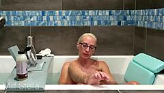 I enjoy bathing and shaving my curvy body with huge tits in the bathroom