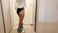 the mature brunette in miniskirt teases with panties, then receives quick handjob cumshot before work