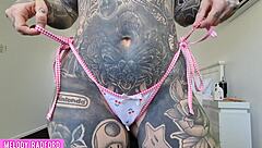 Whoa, check out this cheeky milf trying on bikinis with her big tits 😏