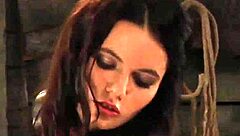 Submissive teen in silk panties faces femdom whipping on bare ass from lesbian mistress in bondage.