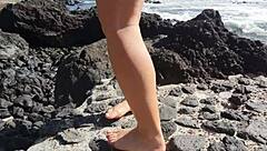 oh wow, this seductive milf's giving me foot fetish vibes right here on the public beach