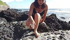 oh wow, this seductive milf's giving me foot fetish vibes right here on the public beach