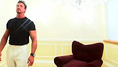 a brunette bimbo with huge fake tits rides in armchair