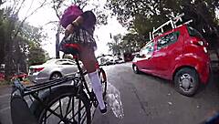 Exhibiting miniskirt upskirt through city streets with pigtails and socks