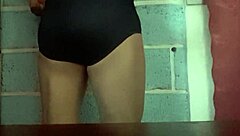 she models her wife's panties in a teasing display before slipping them off for a close-up view