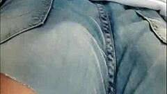 Watch this naughty babe flaunt her huge clit and hairy pussy in tight jeans shorts - no panties!