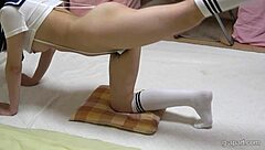 Japanese girl in thong leotard shows wedgie ass and pussy with natural tits during exercise