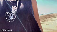 wife enjoys a relaxing walk around the public beach without clothes