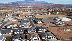 Teen studies while getting used by friend in group session