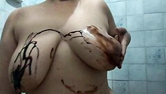 chubby girl with natural big tits masturbates covered in chocolate until orgasm hits