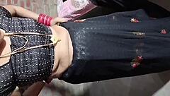 Hey, check out this Indian beauty in black saree pissing outdoors