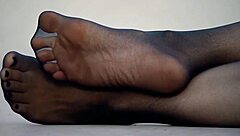 Exciting feet display in sleek nylon pantyhose!