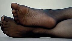 Exciting feet display in sleek nylon pantyhose!
