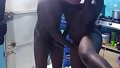 African amateur bends over in kitchen revealing big pussy lips and wet ebony slit