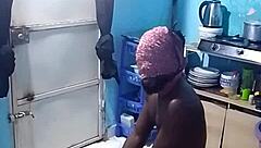 African amateur bends over in kitchen revealing big pussy lips and wet ebony slit