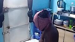 African amateur bends over in kitchen revealing big pussy lips and wet ebony slit