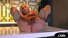 Hey, check out this busty blonde shemale tugging and flaunting her big ass! 🍑👠