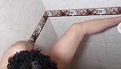 latina lesbian squirts wildly in steamy solo shower