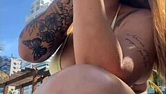 Horny beach exhibitionist flashes big pussy for guys