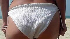 fat ass pees white bikini on crowded public beach!