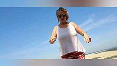 Mature blonde big tits solo beach pose