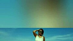 Mature blonde big tits solo beach pose