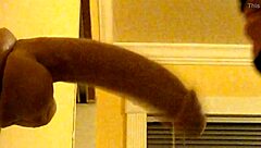 Bold gay guy in hood deepthroats dildo