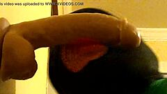 Bold gay guy in hood deepthroats dildo