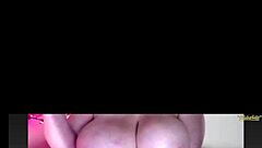watching big juicy tits bounce on webcam, teasing with every move, inviting closer look at those boobs