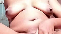 She fingers her big pussy.