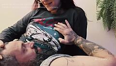 Tatted brunette sucks big cock