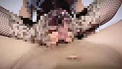 Wearing fishnet tights for a teasing footjob on big cock