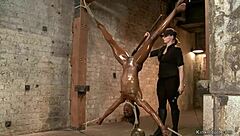 ebony lesbian deepthroats dildo in upside down bondage position