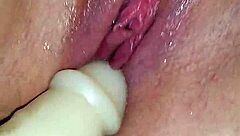 Shaved pussy squirts wet cum on dildo during intense orgasm