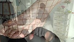 worshipping masked girl's feet in fishnets and stockings