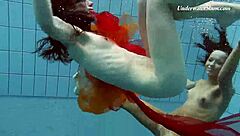Krasula Fedorchuk and Liza Rachinska dive into underwater lesbian passion in the pool.